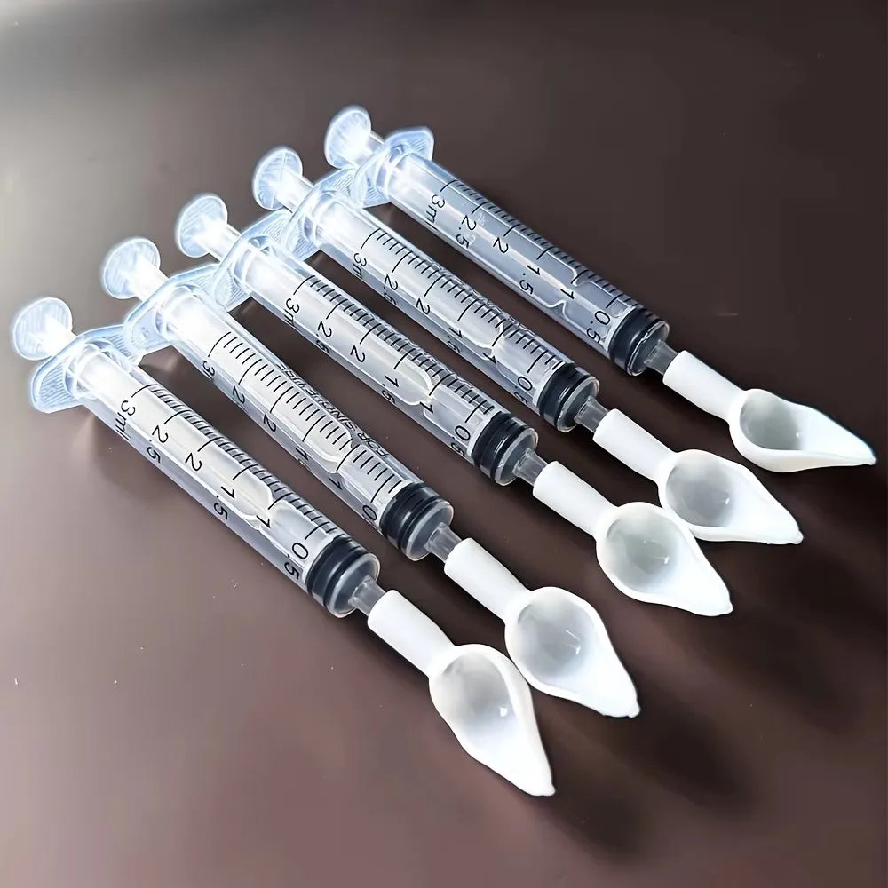 Bird medication feeding kit in a box, 10 feeding tubes, 5 syringes, 5 small spoons, 1 large spoon, measuring cup and box