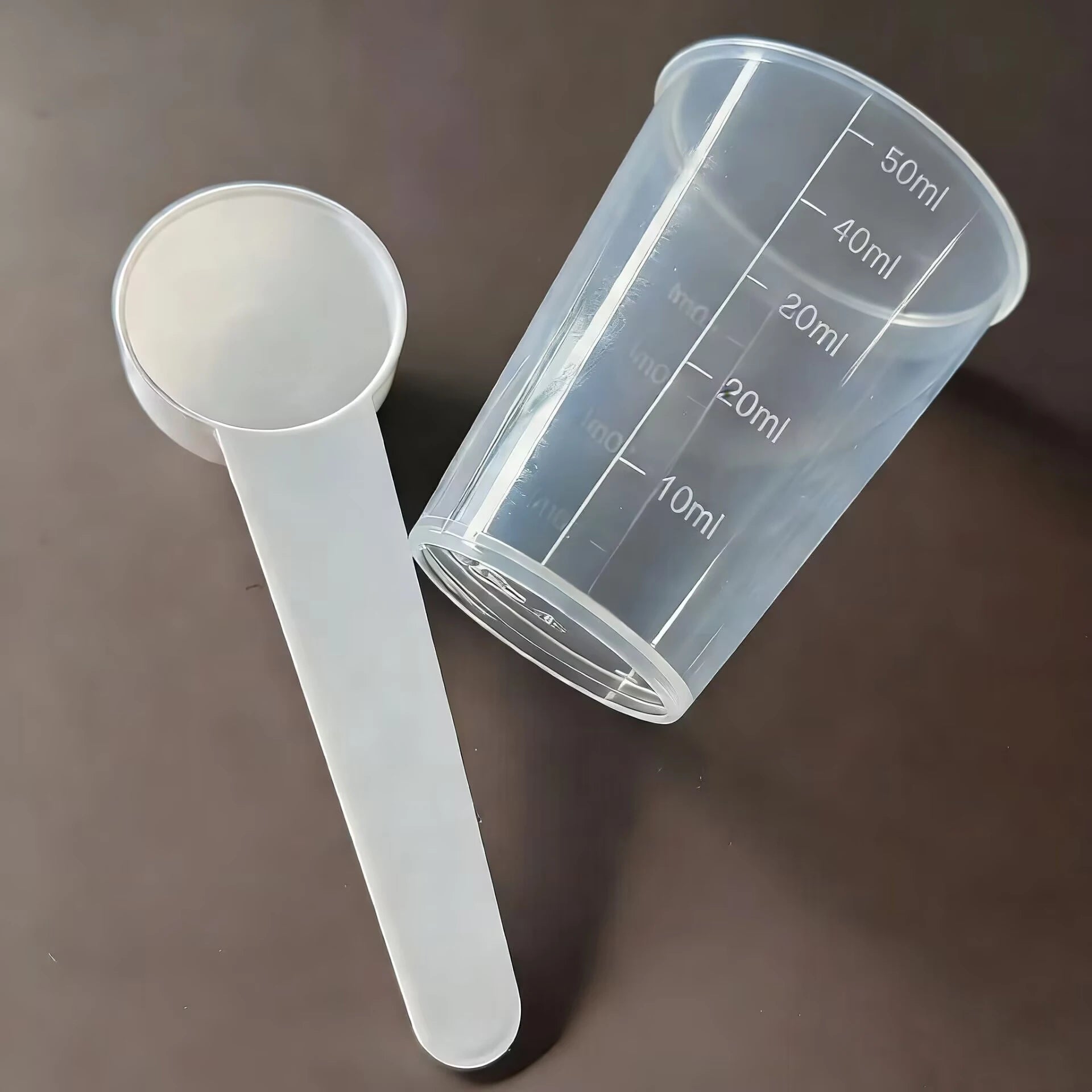 Bird medication feeding kit in a box, 10 feeding tubes, 5 syringes, 5 small spoons, 1 large spoon, measuring cup and box